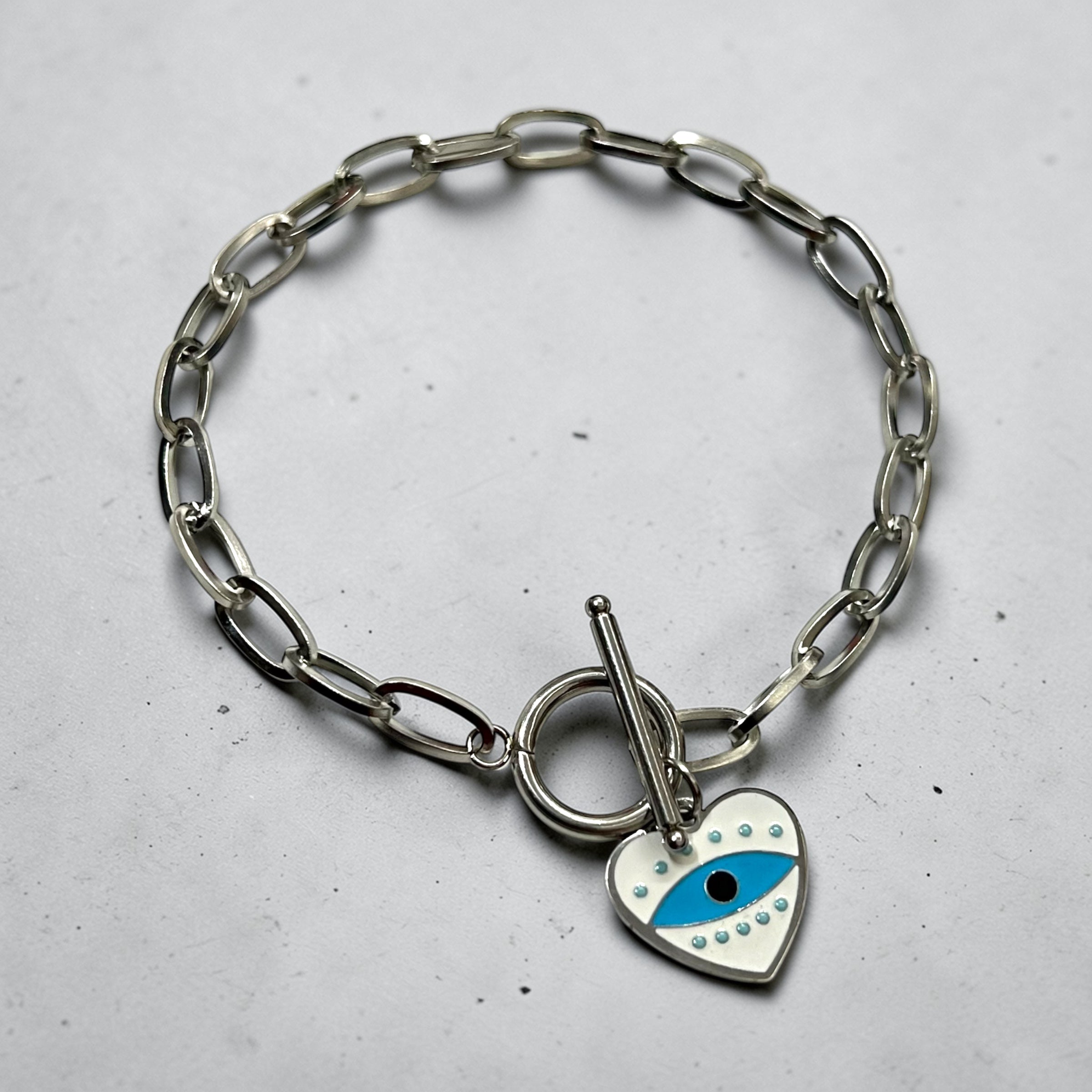 Silver Heart Charm Bracelet ā Evil Eye Edition