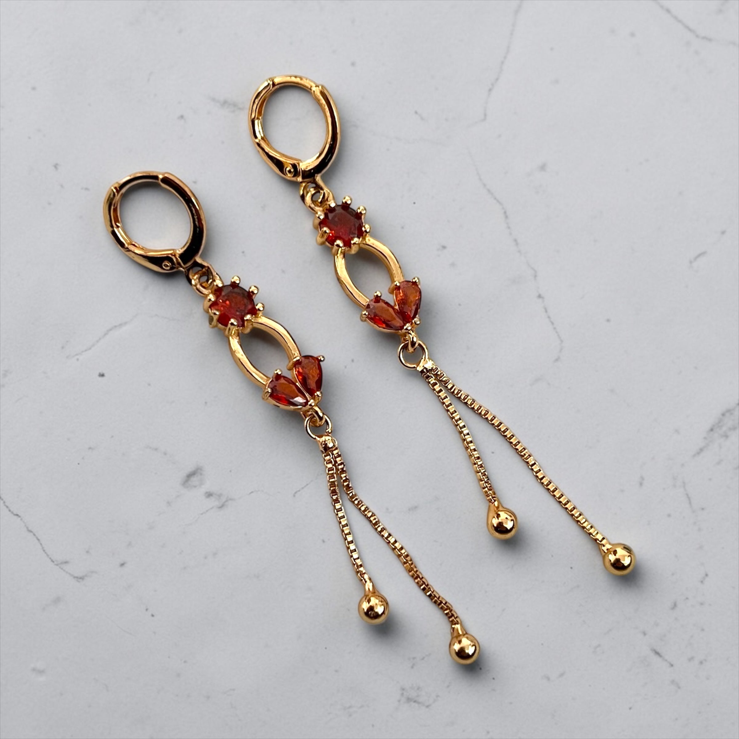 Gold-Plated Drop Earrings with Red Crystal Details