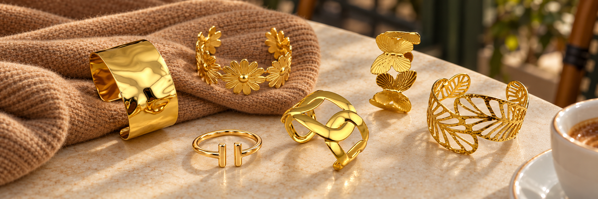 Poshewix Final Pieces collection styled on a warm café table with camel knit
