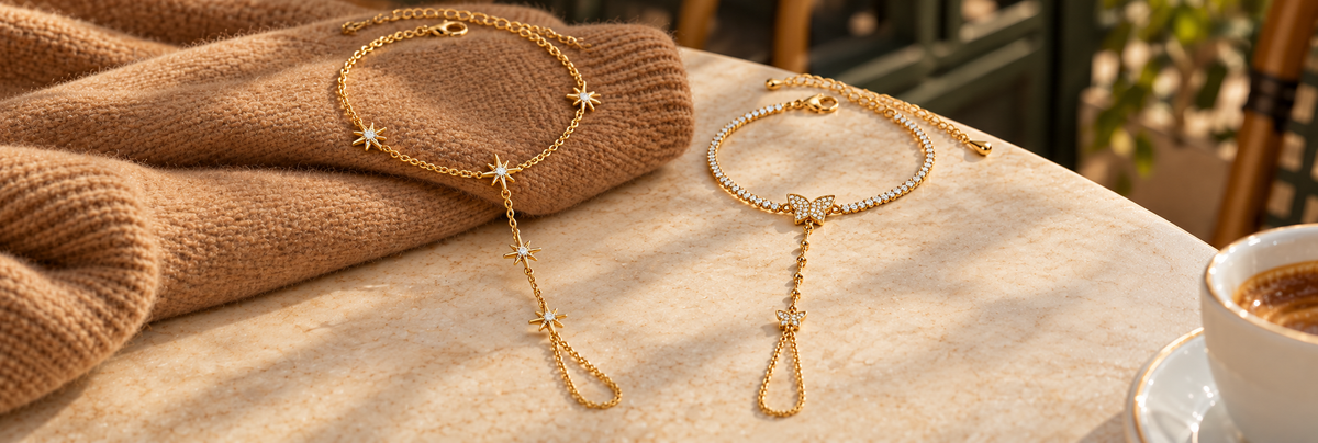 Poshewix Hand Chains collection styled on a warm café table with camel knit