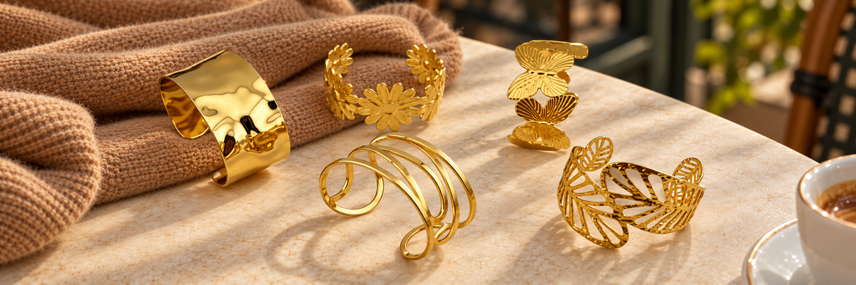 Poshewix Arm Cuffs collection styled on a warm café table with camel knit