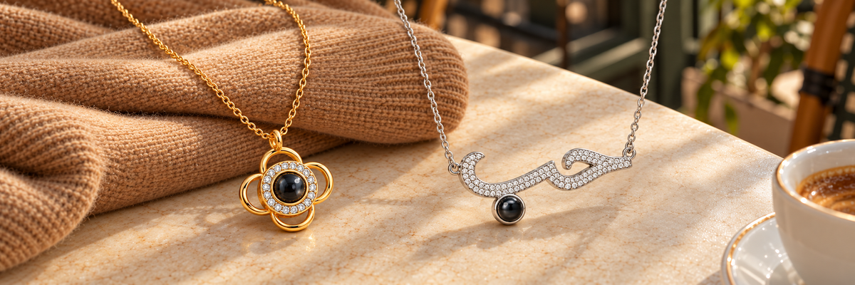 Poshewix Necklaces collection styled on a warm café table with camel knit