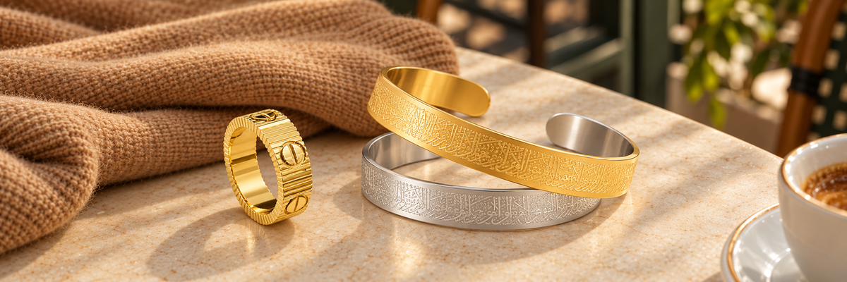 Poshewix Stainless steel 316L collection styled on a warm café table with camel knit