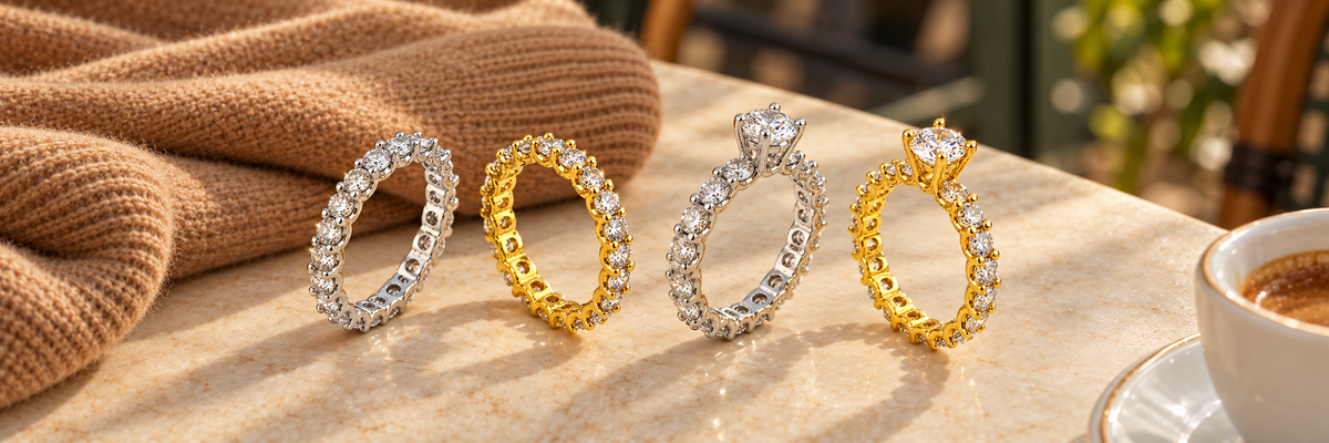 Poshewix Wedding Rings collection styled on a warm café table with camel knit