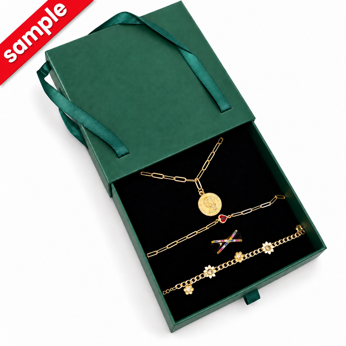 Poshewix Mystery Box sample: green gift box with 4 surprise gold-plated jewelry pieces (example contents)